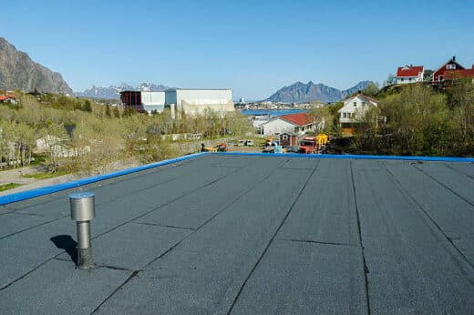 Draining water from a flat roof with Life Roofing in Austin, Tx a roofing company near you